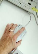 image of hand on a computer mouse